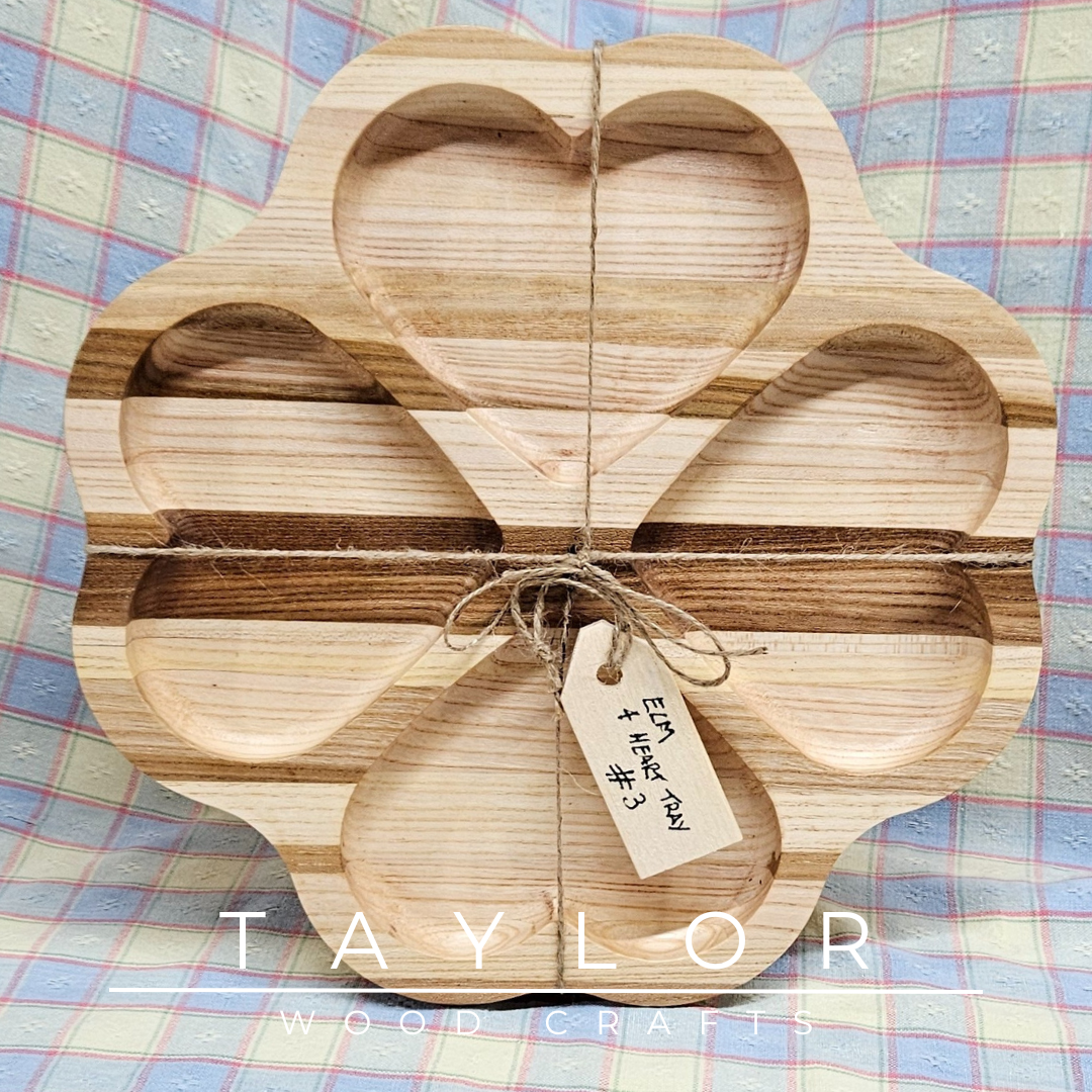 Discover our handcrafted elm wood serving tray, featuring a distinctive four-heart design. Perfect for serving treats, displaying decor, or as a thoughtful gift.