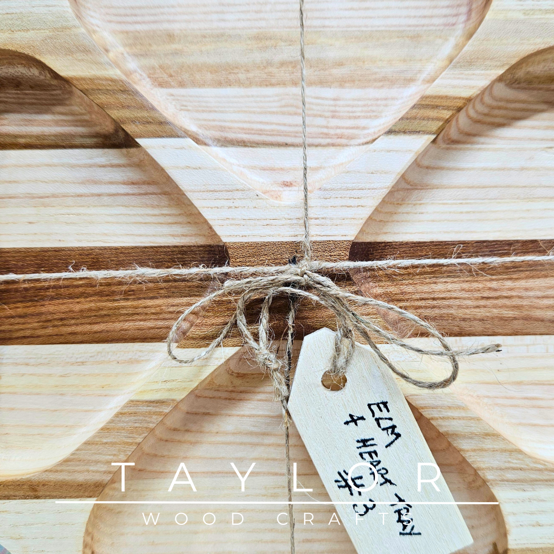 Discover our handcrafted elm wood serving tray, featuring a distinctive four-heart design. Perfect for serving treats, displaying decor, or as a thoughtful gift.