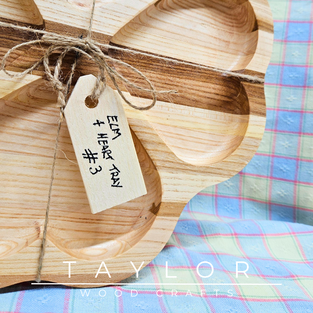 Discover our handcrafted elm wood serving tray, featuring a distinctive four-heart design. Perfect for serving treats, displaying decor, or as a thoughtful gift.