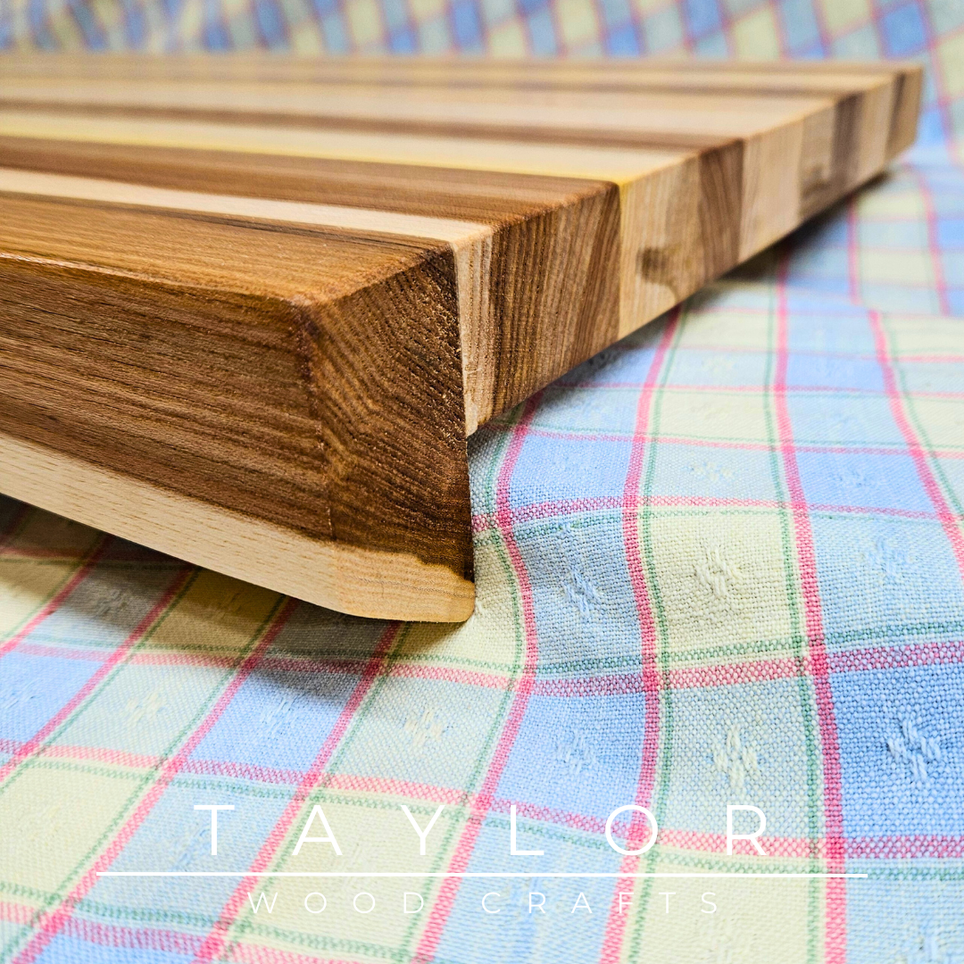 Handcrafted large-scale countertop board with a live edge front, curving elegantly over the edge of your worktop for a unique, functional touch.