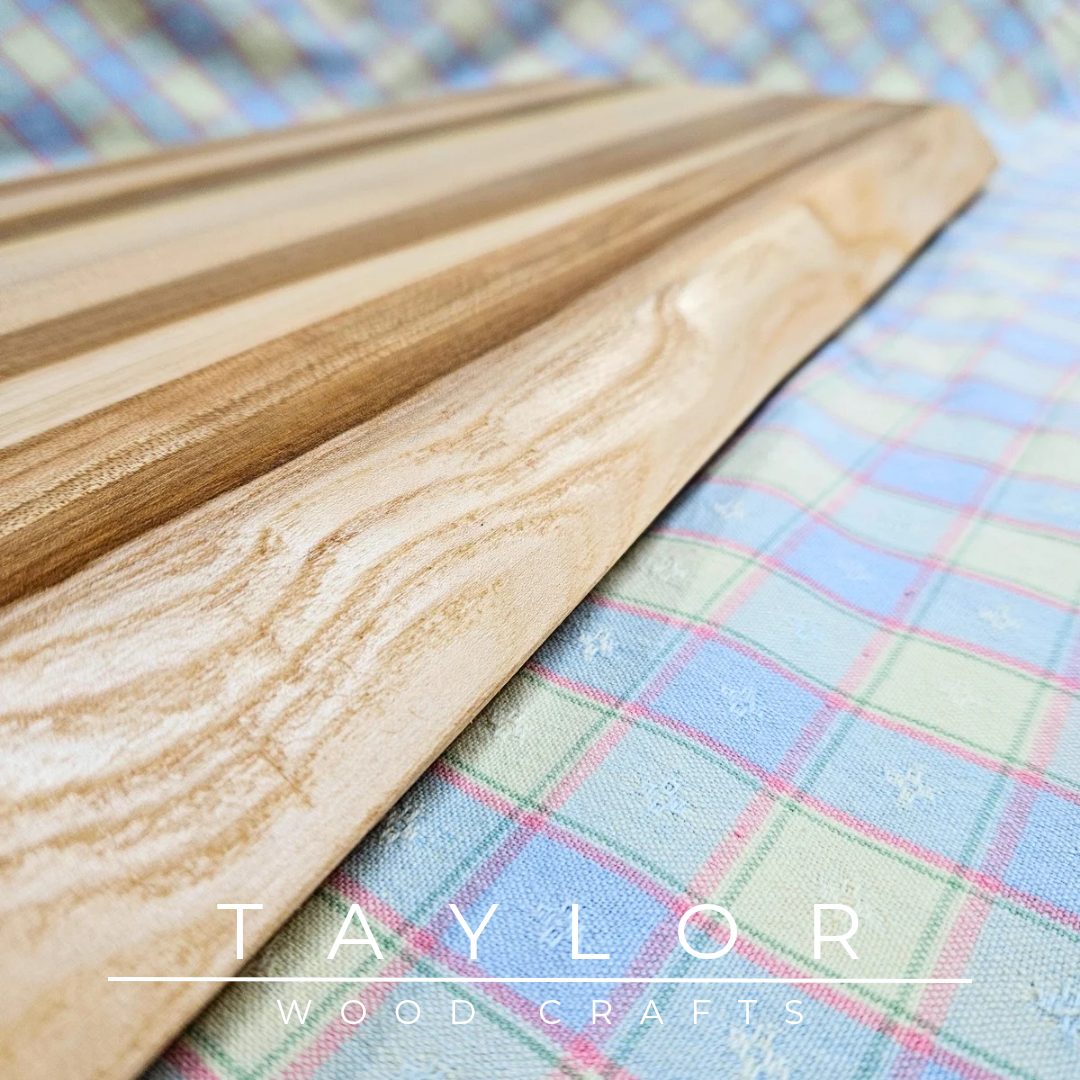 Handmade hardwood charcuterie board, crafted from locally sourced wood and finished with food-safe oils.