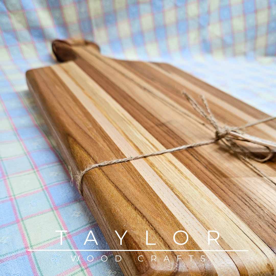 Handcrafted paddle board made from elm wood, featuring a leather string for hanging, offering durability and rustic charm.
