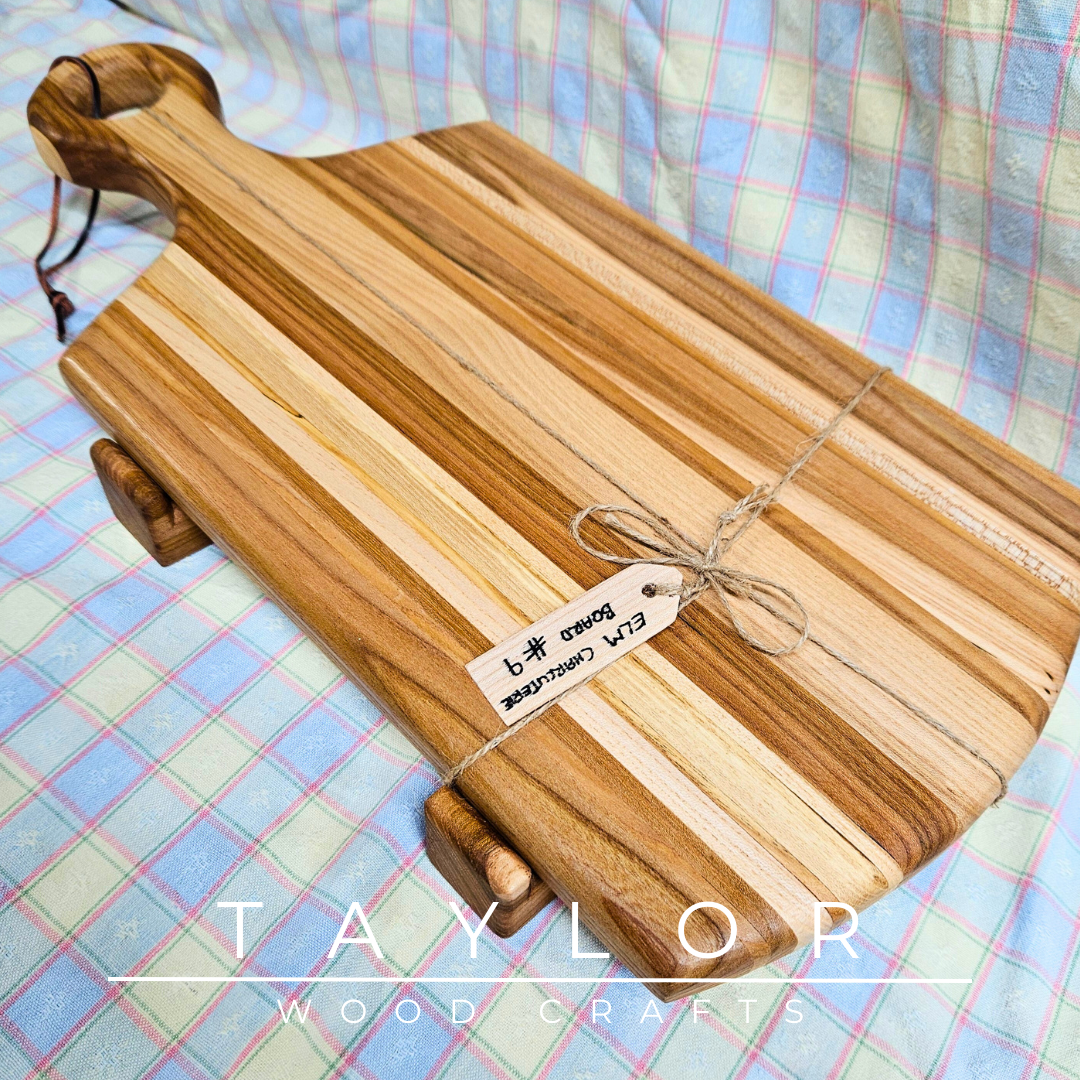 Handcrafted paddle board made from elm wood, featuring a leather string for hanging, offering durability and rustic charm.