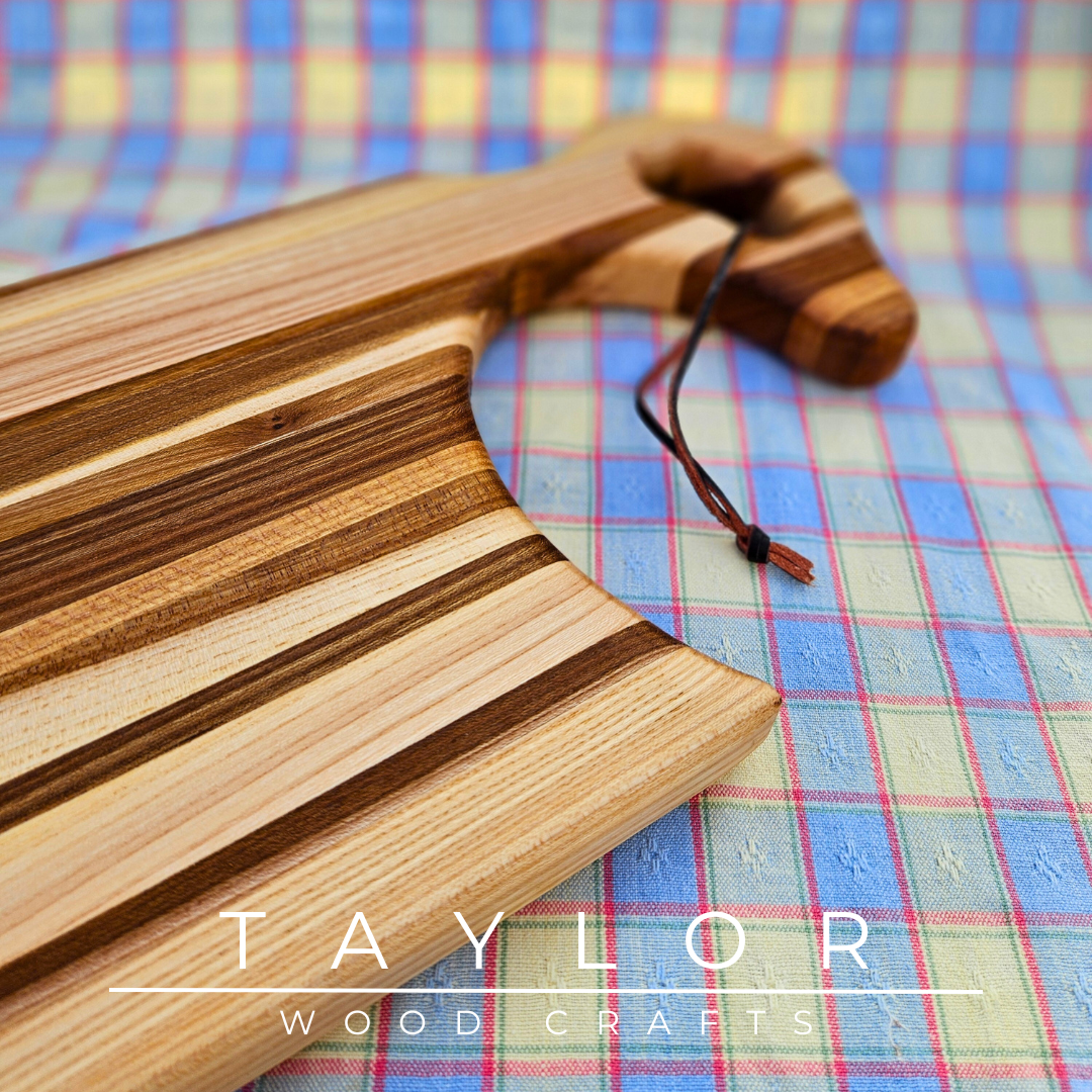 Handcrafted charcuterie board with a swan neck handle and leather string, combining elegance and functionality for serving in style.