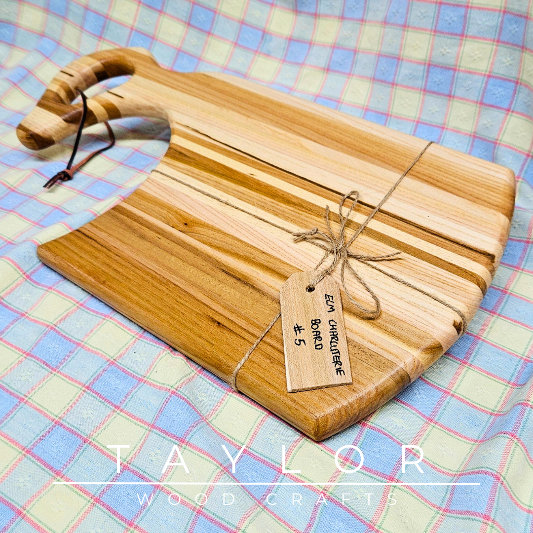 Handcrafted charcuterie board with a swan neck handle and leather string, combining elegance and functionality for serving in style.
