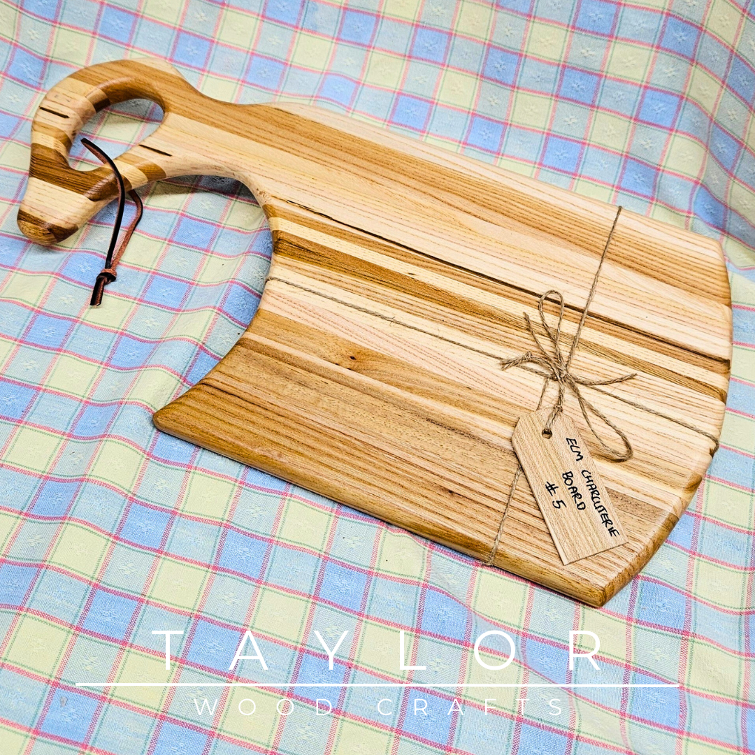 Handcrafted charcuterie board with a swan neck handle and leather string, combining elegance and functionality for serving in style.