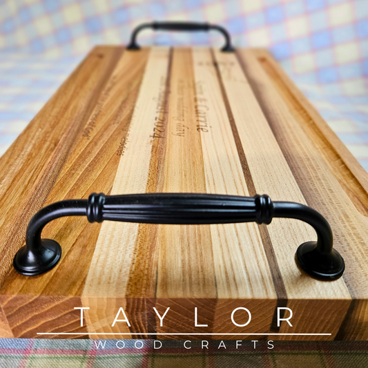 Handcrafted charcuterie board with handles and personalized laser engraving, adding a custom touch and elegance for serving appetizers.