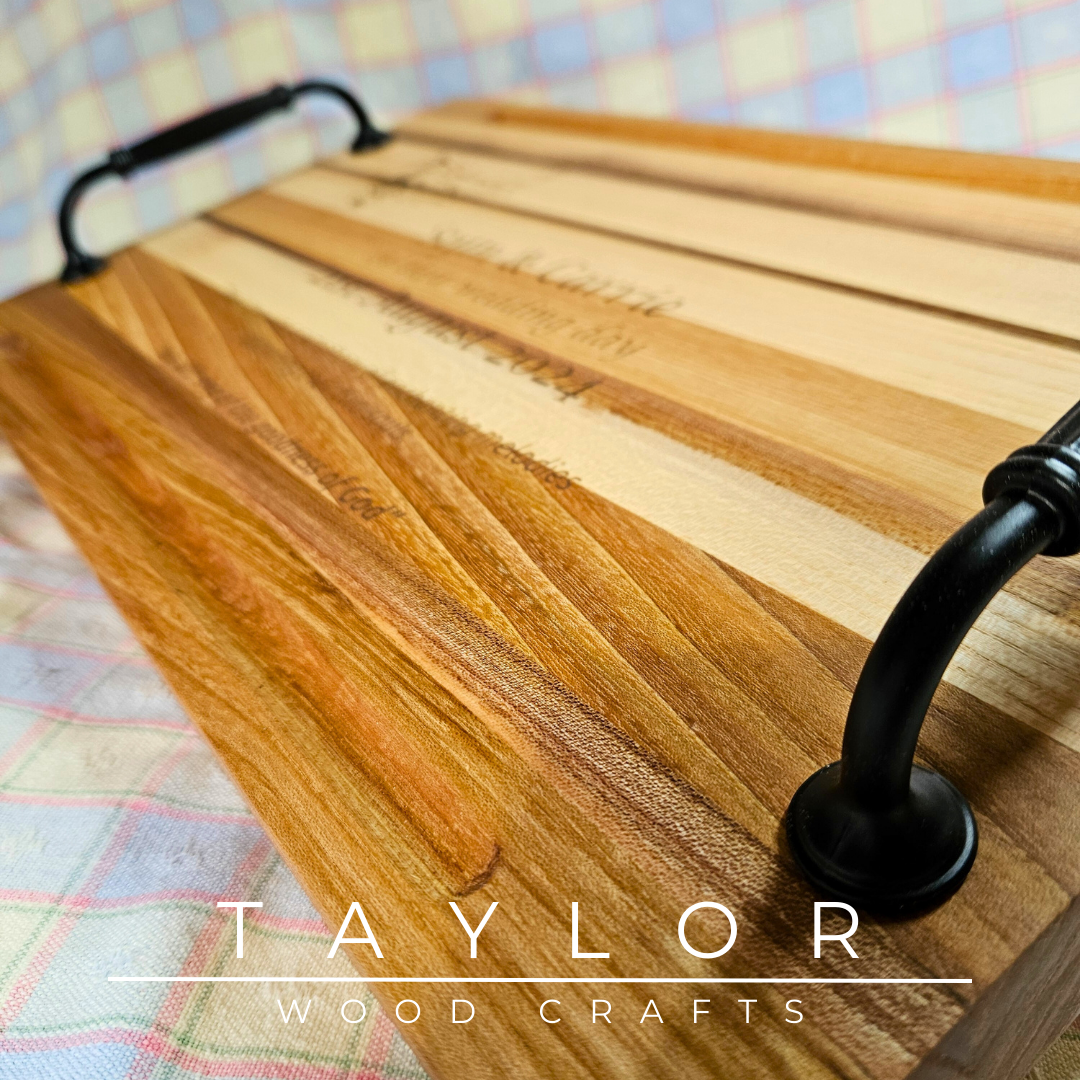 Handcrafted charcuterie board with handles and personalized laser engraving, adding a custom touch and elegance for serving appetizers.