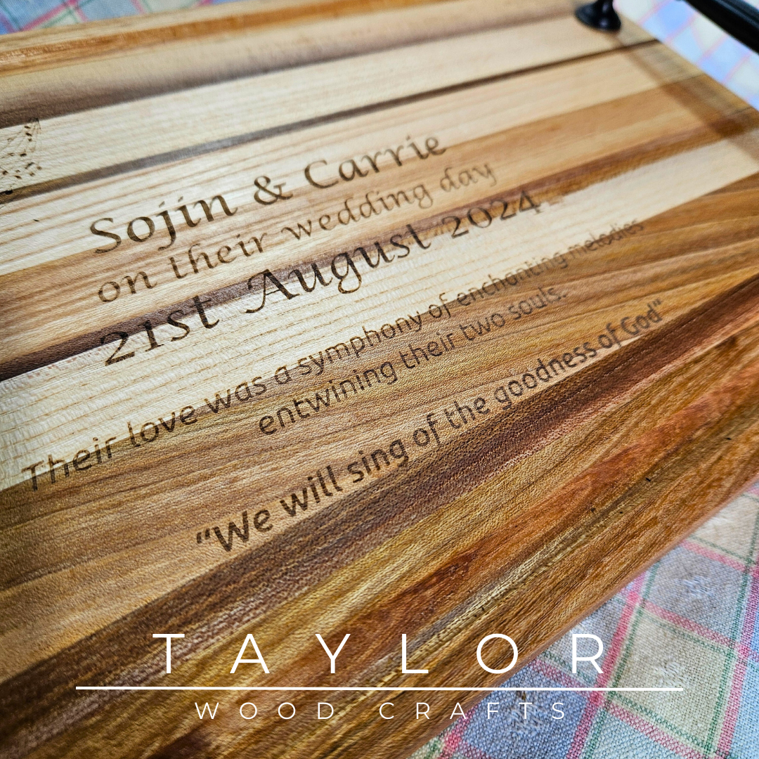 Handcrafted charcuterie board with handles and personalized laser engraving, adding a custom touch and elegance for serving appetizers.