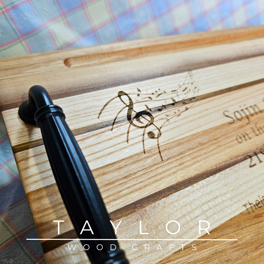 Handcrafted charcuterie board with handles and personalized laser engraving, adding a custom touch and elegance for serving appetizers.