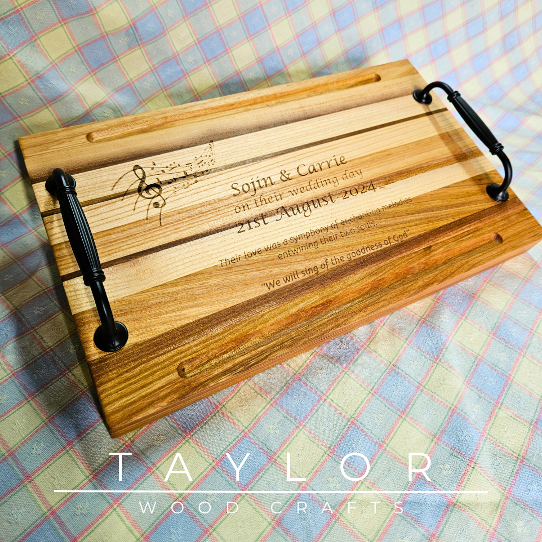 Handcrafted charcuterie board with handles and personalized laser engraving, adding a custom touch and elegance for serving appetizers.