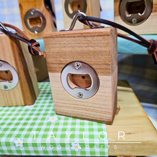 Handcrafted bottle opener with a leather string for hanging, combining durability and style for easy bottle opening and convenient storage.