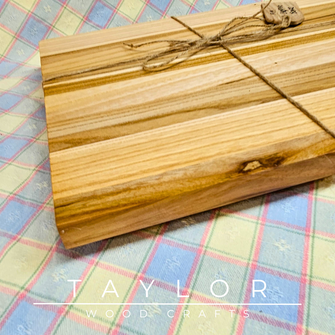 Handmade hardwood charcuterie board, crafted from locally sourced wood and finished with food-safe oils.