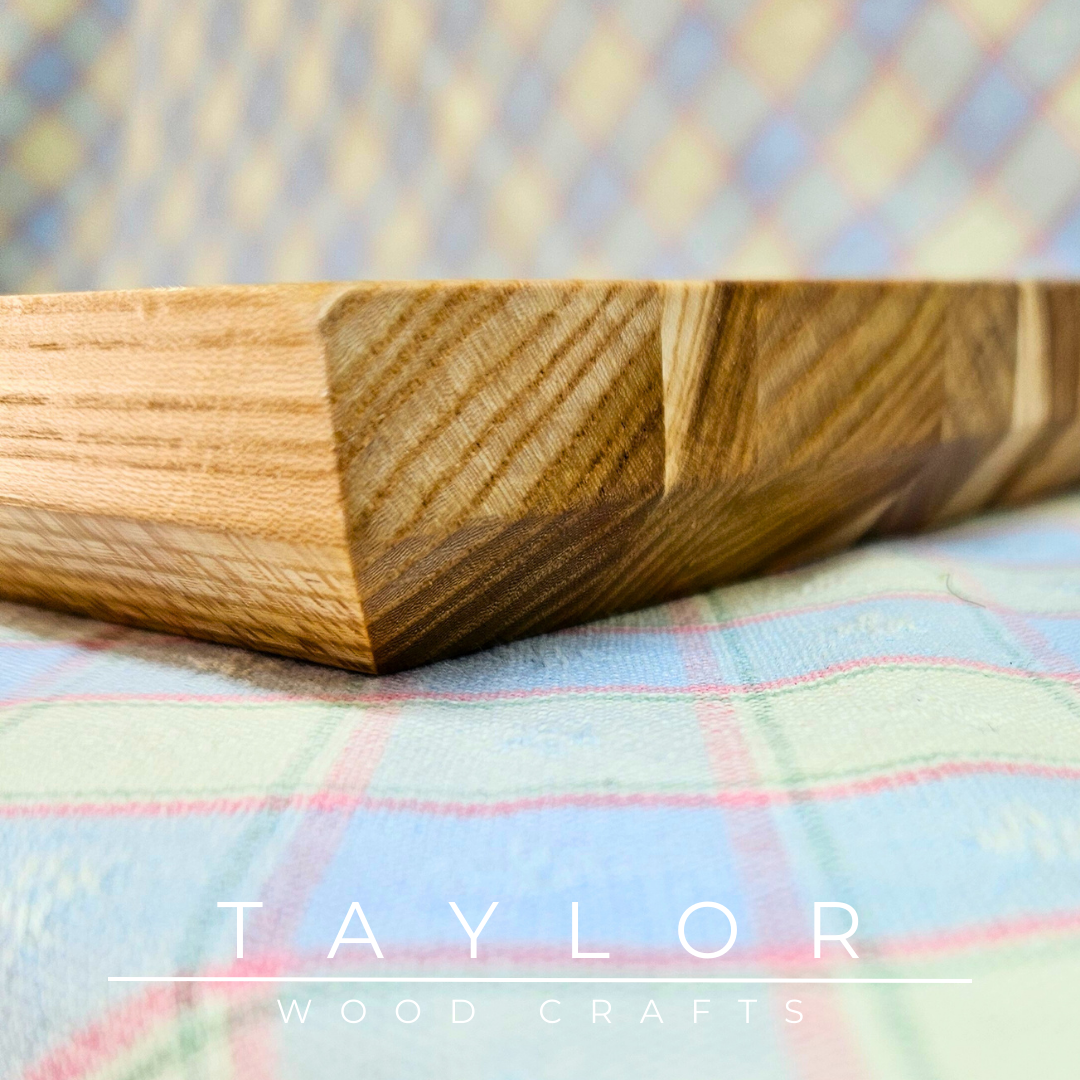 Handmade hardwood charcuterie board, crafted from locally sourced wood and finished with food-safe oils.