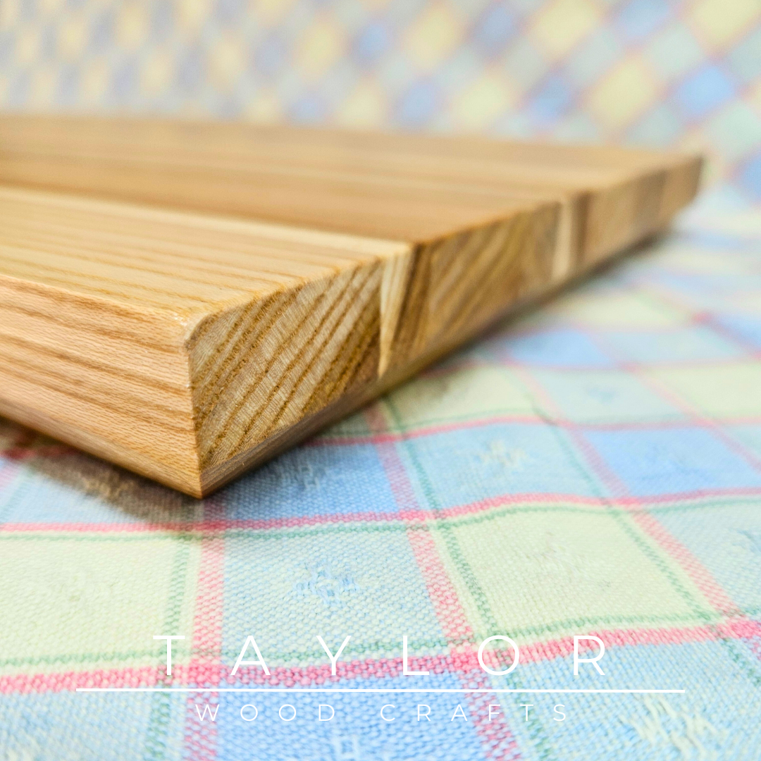 Handmade hardwood charcuterie board, crafted from locally sourced wood and finished with food-safe oils.