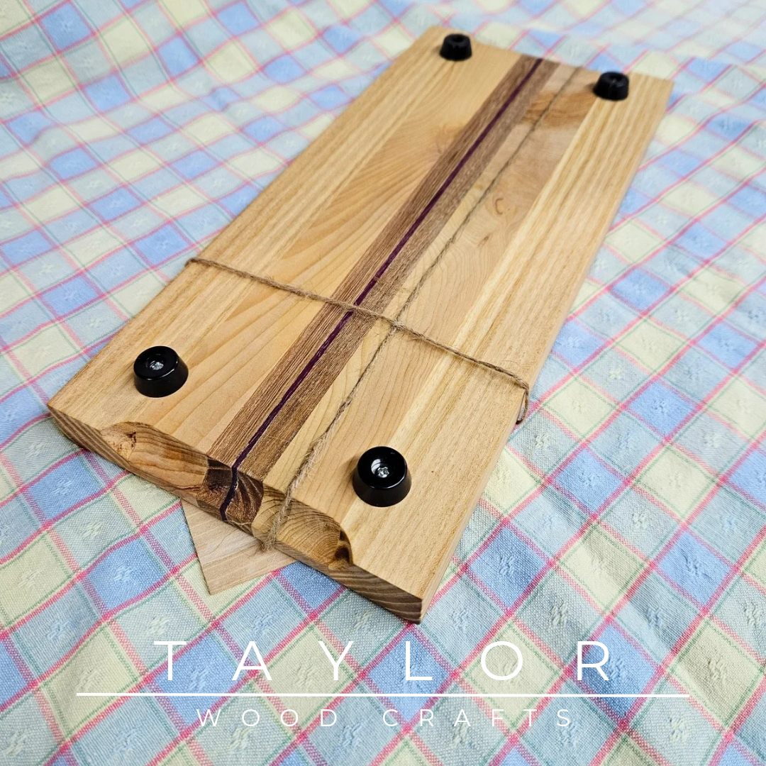 Handcrafted chopping board made from walnut, purple heart, and cedar wood, offering durability and unique style for your kitchen.