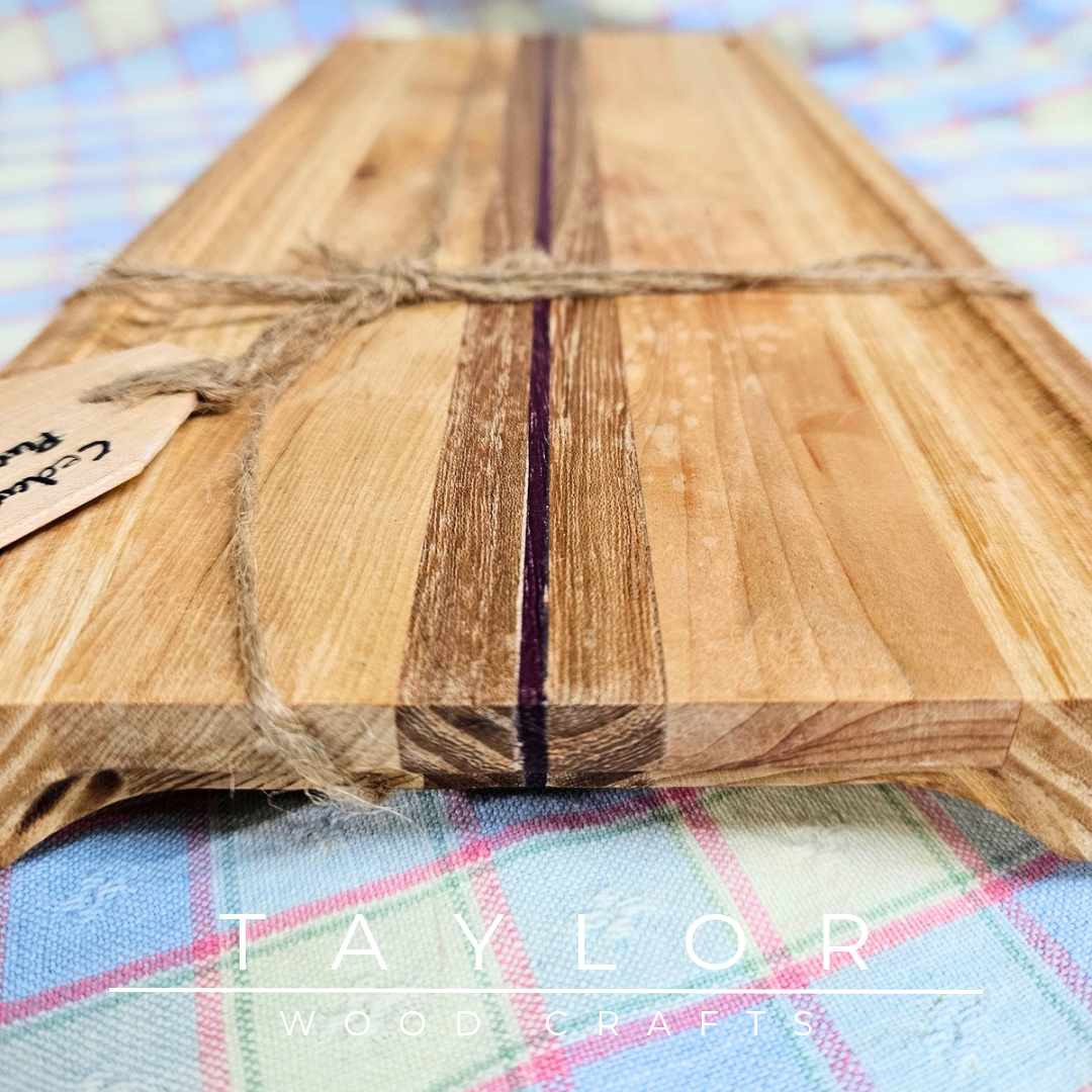 Handcrafted chopping board made from walnut, purple heart, and cedar wood, offering durability and unique style for your kitchen.