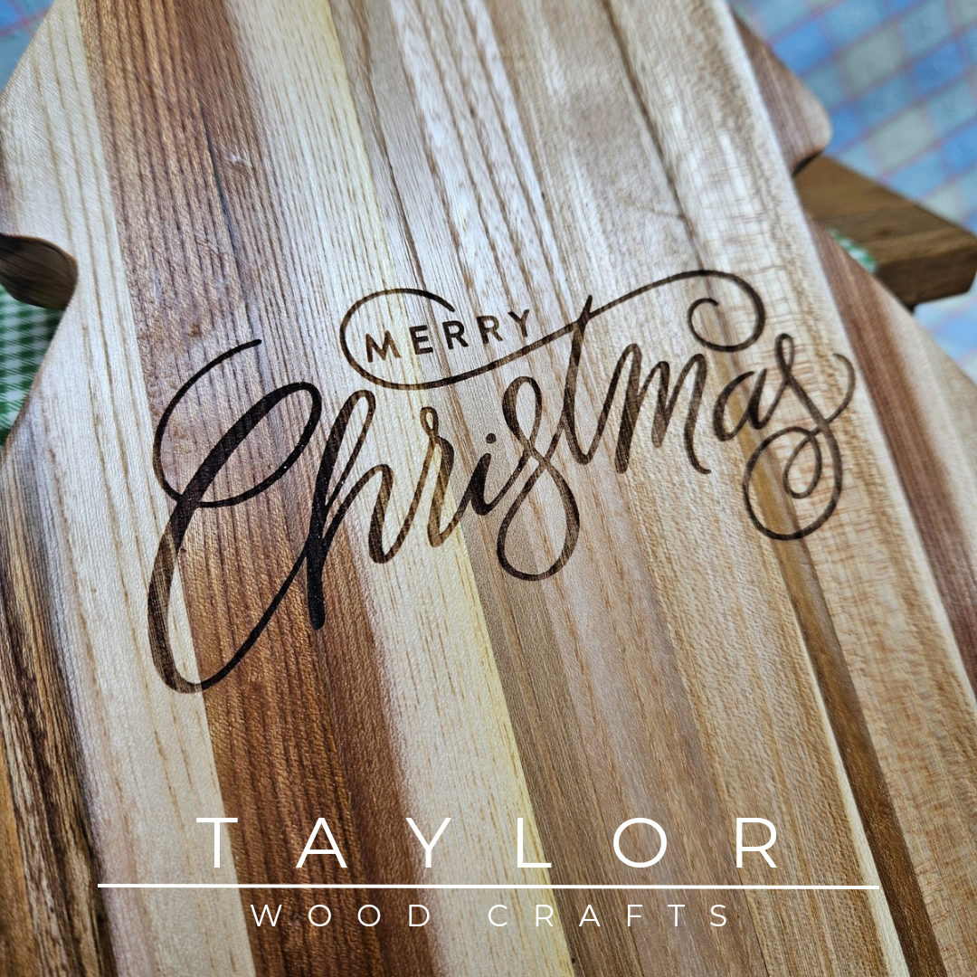 Handcrafted Christmas tree-shaped charcuterie board with 'Merry Christmas' laser engraving, adding festive charm and elegance for serving treats.