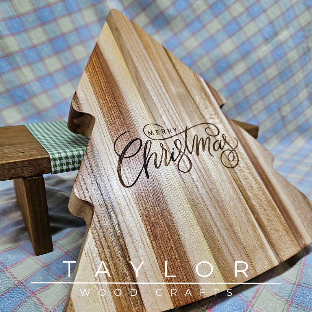 Handcrafted Christmas tree-shaped charcuterie board with 'Merry Christmas' laser engraving, adding festive charm and elegance for serving treats.