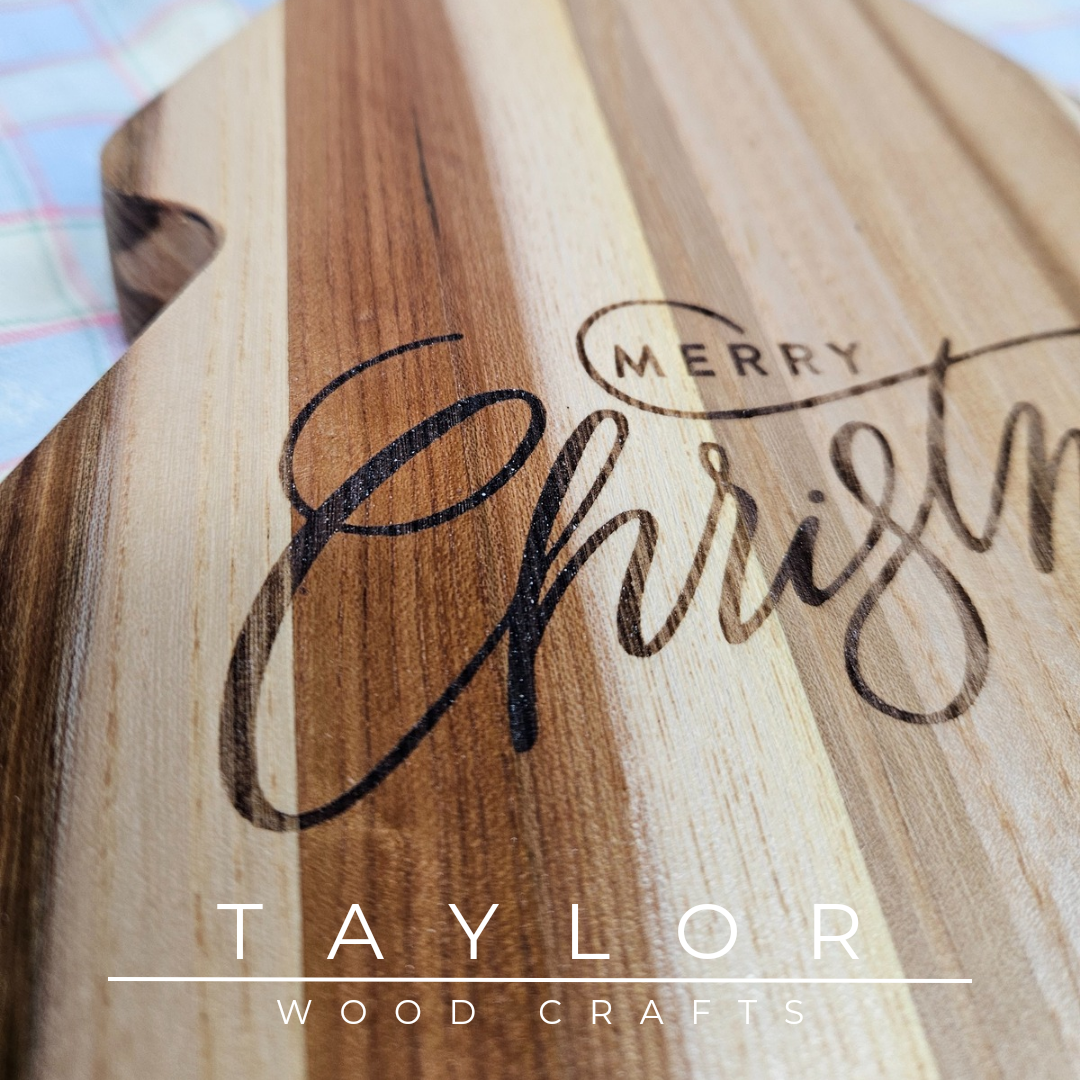 Handcrafted Christmas tree-shaped charcuterie board with 'Merry Christmas' laser engraving, adding festive charm and elegance for serving treats.