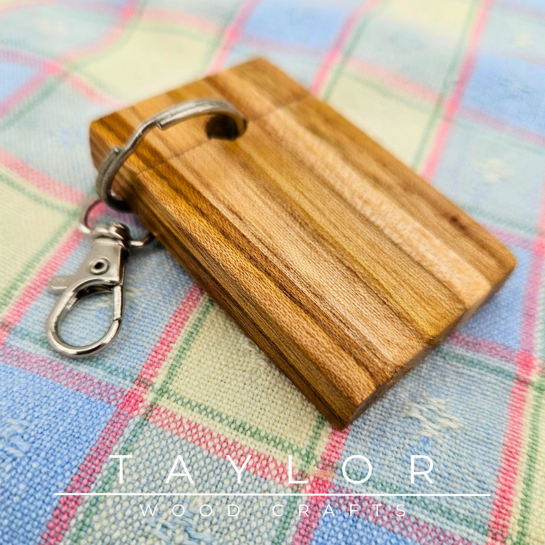 Handcrafted keyring made with elm wood, offering natural elegance and durability to keep your keys organized in style.