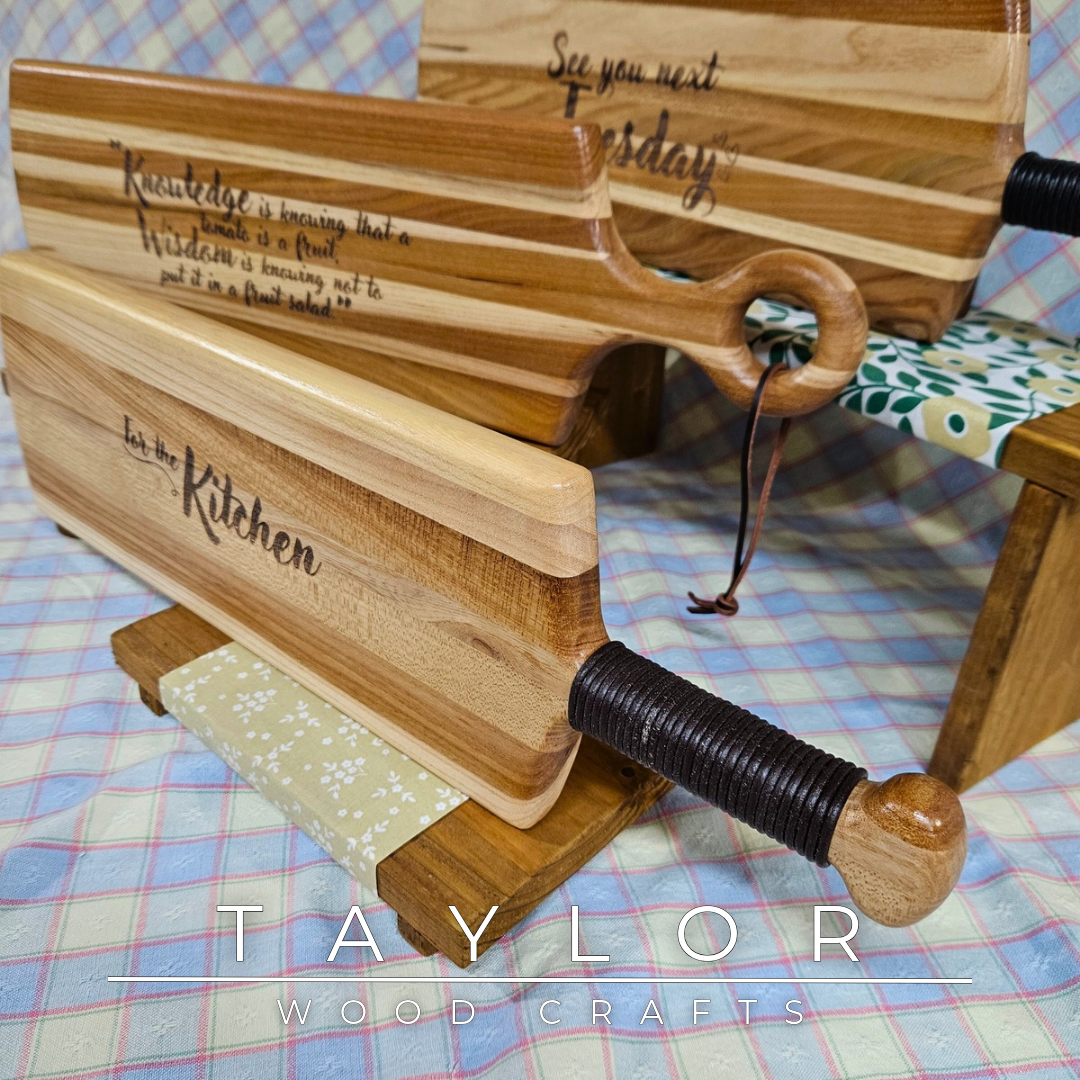 Handcrafted elm wood charcuterie board shaped like a paddle, showcasing rich wood grain for a rustic and elegant touch.
