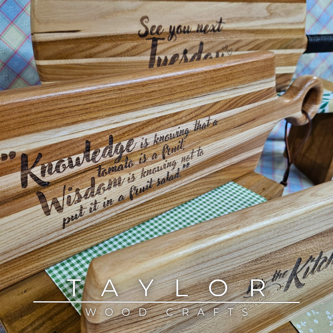 Handcrafted elm wood charcuterie board shaped like a paddle, showcasing rich wood grain for a rustic and elegant touch.