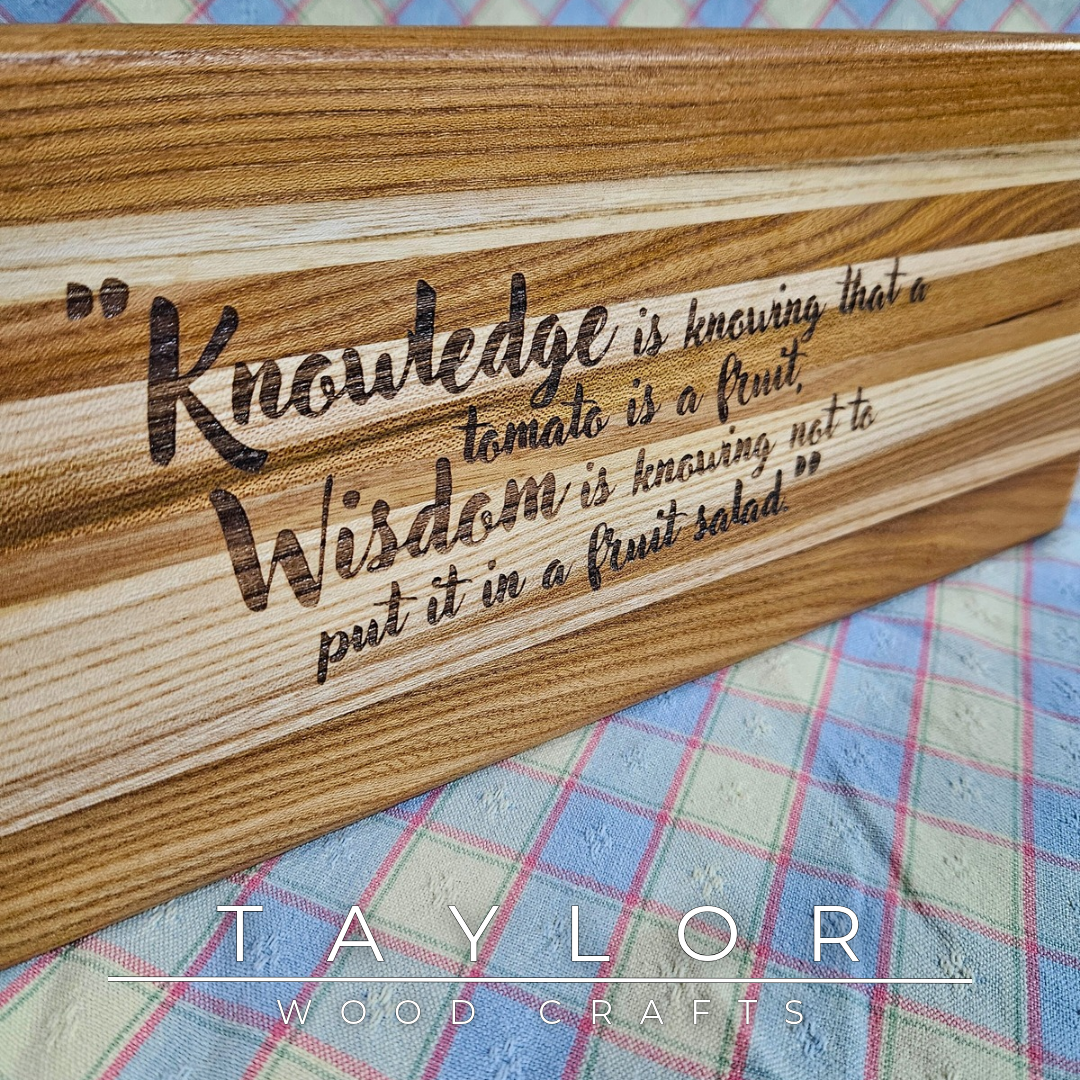 Handcrafted elm wood charcuterie board shaped like a paddle, showcasing rich wood grain for a rustic and elegant touch.