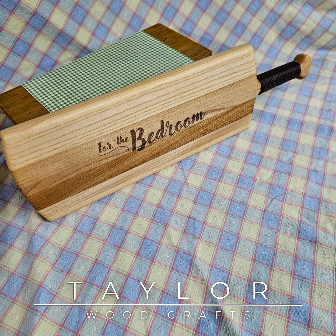 Handcrafted elm wood charcuterie board shaped like a paddle, showcasing rich wood grain for a rustic and elegant touch.