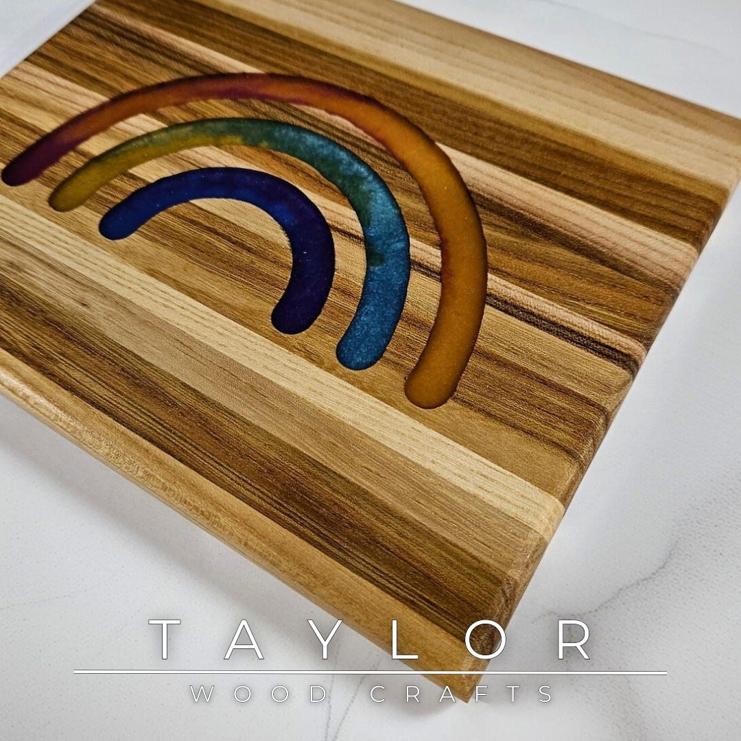 This handcrafted trivet pairs natural wood with a bold rainbow epoxy insert, creating a one-of-a-kind blend of function and color. Designed as a stylish worktop protector, it keeps your surfaces safe while adding a splash of personality. Durable and full of charm, it’s a fun, practical addition to any kitchen or dining table.