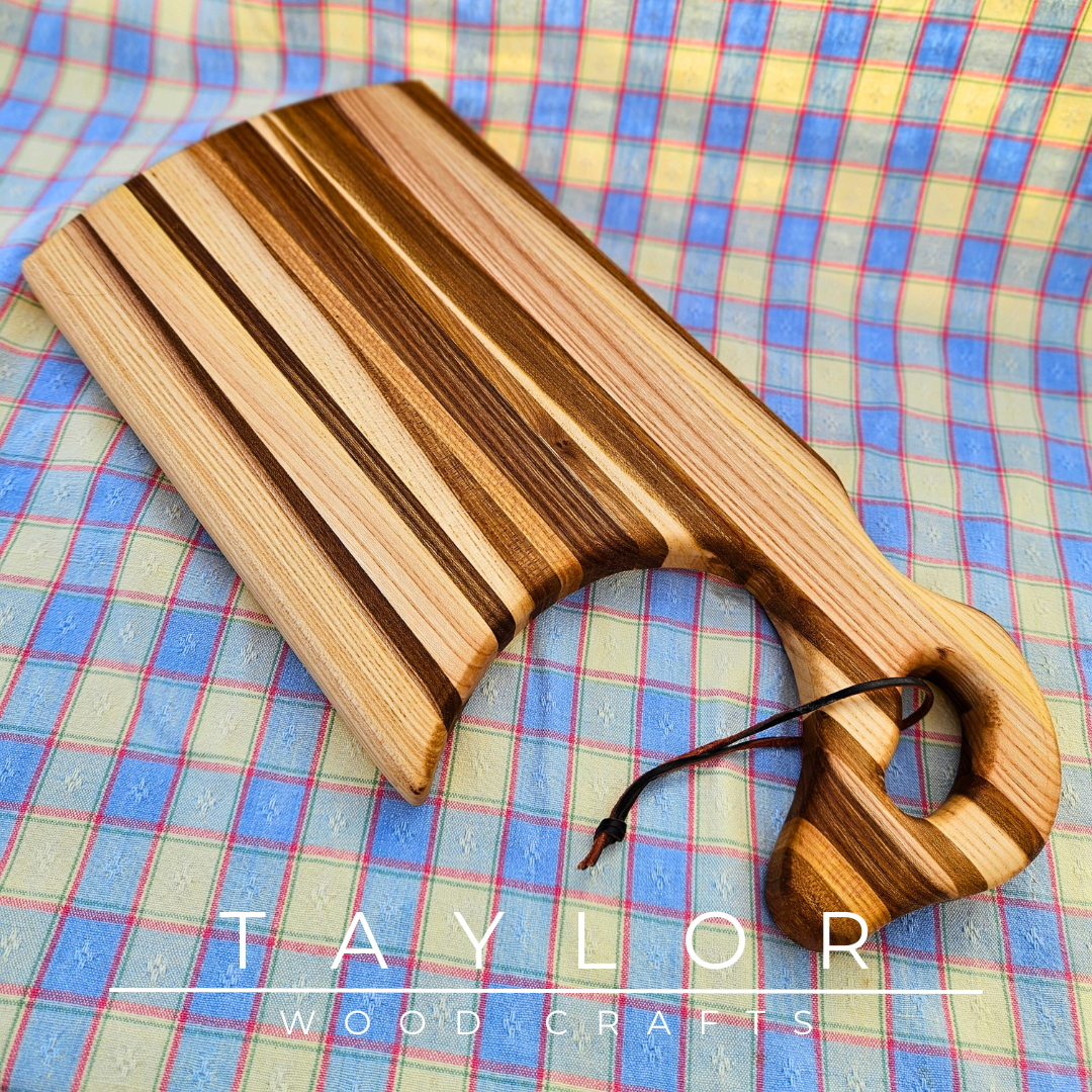 Handcrafted charcuterie board with a swan neck handle and leather string, combining elegance and functionality for serving in style.
