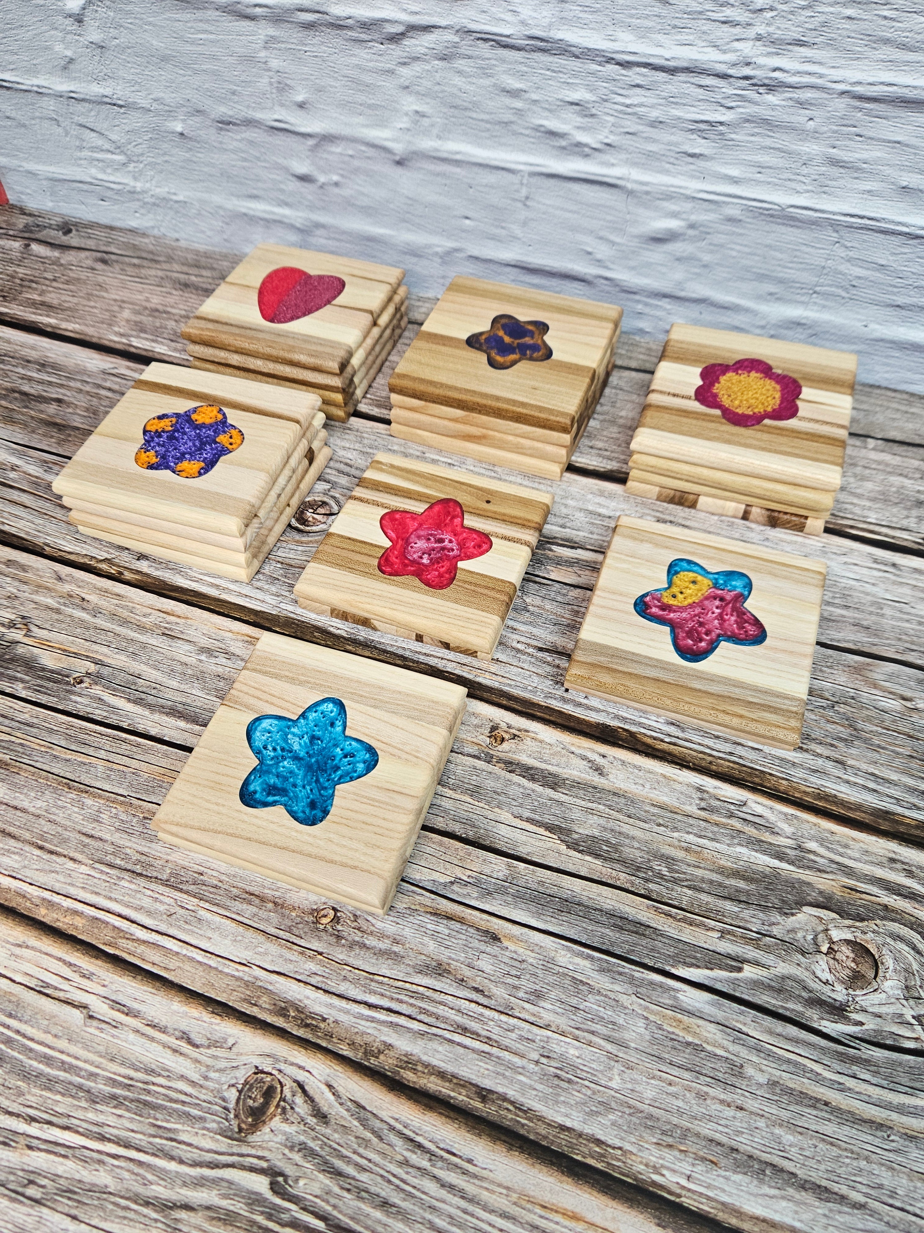 Taylor Wood Crafts. Handcrafted elm wood coasters with vibrant epoxy resin inserts, combining durability, style, and a pop of color to protect your surfaces.