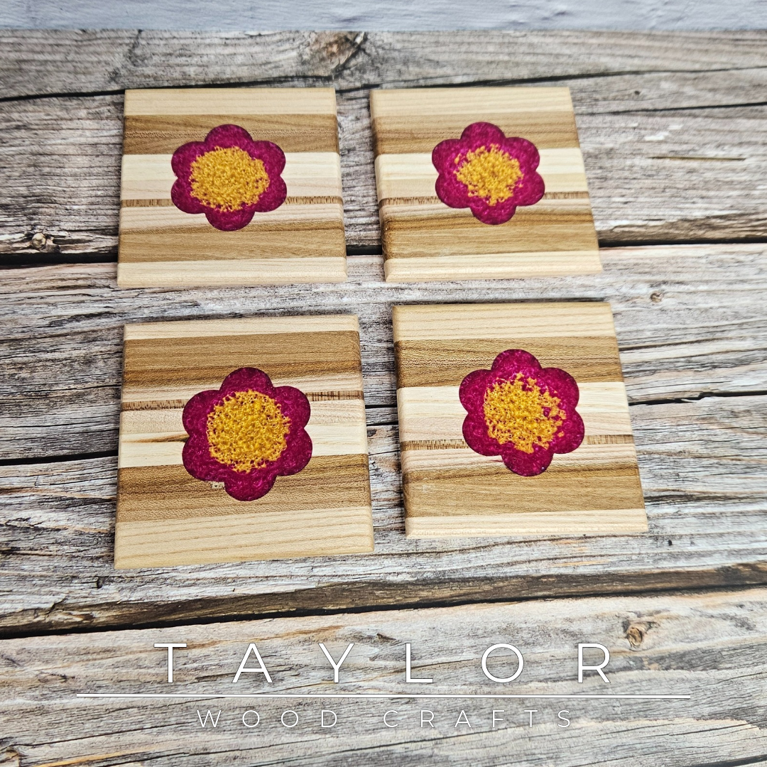 Taylor Wood Crafts. Handcrafted elm wood coasters with vibrant epoxy resin inserts, combining durability, style, and a pop of color to protect your surfaces.