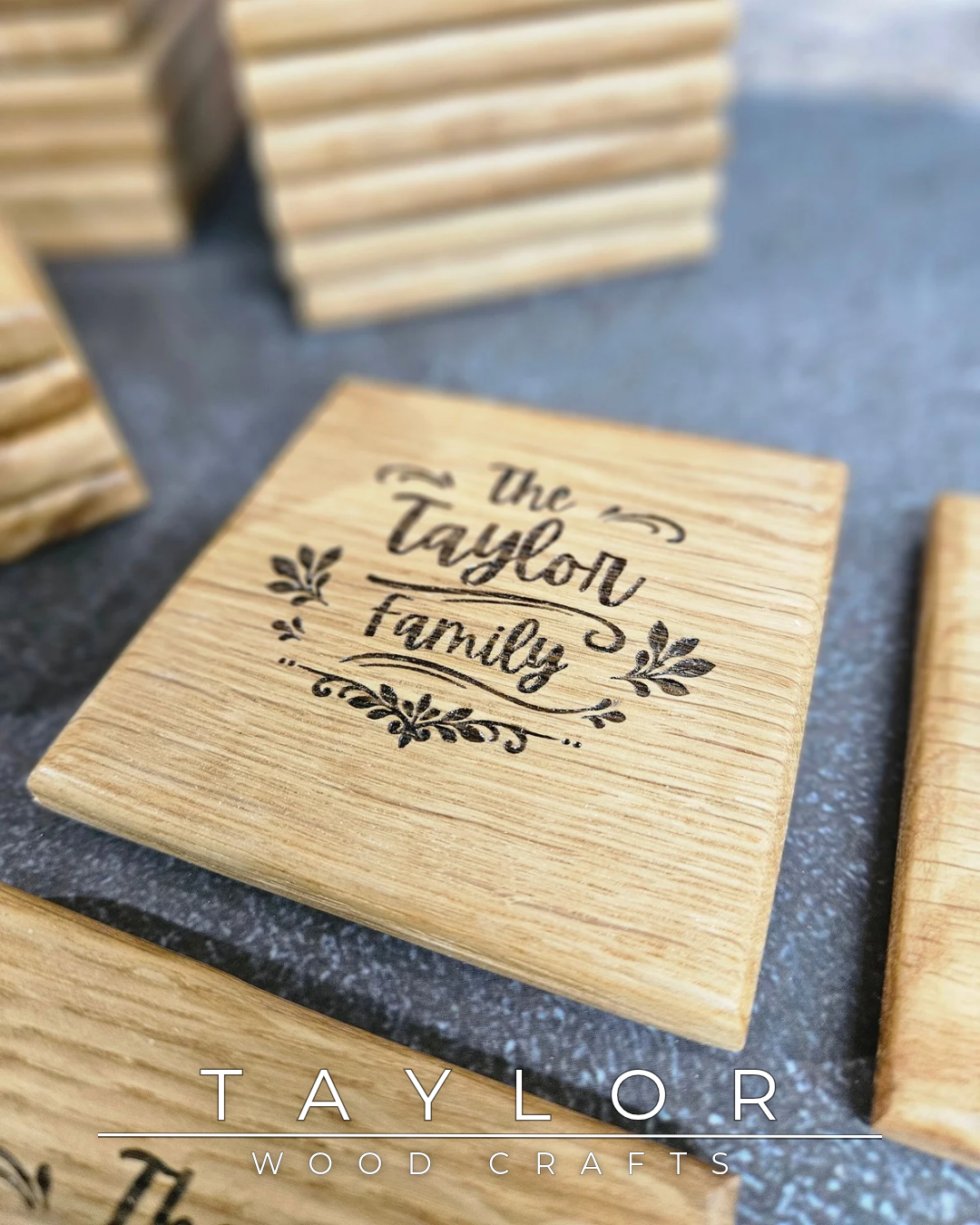 Wooden blocks with 'The Taylor Family' engraving on a dark surface, with 'Taylor Wood Crafts' branding.