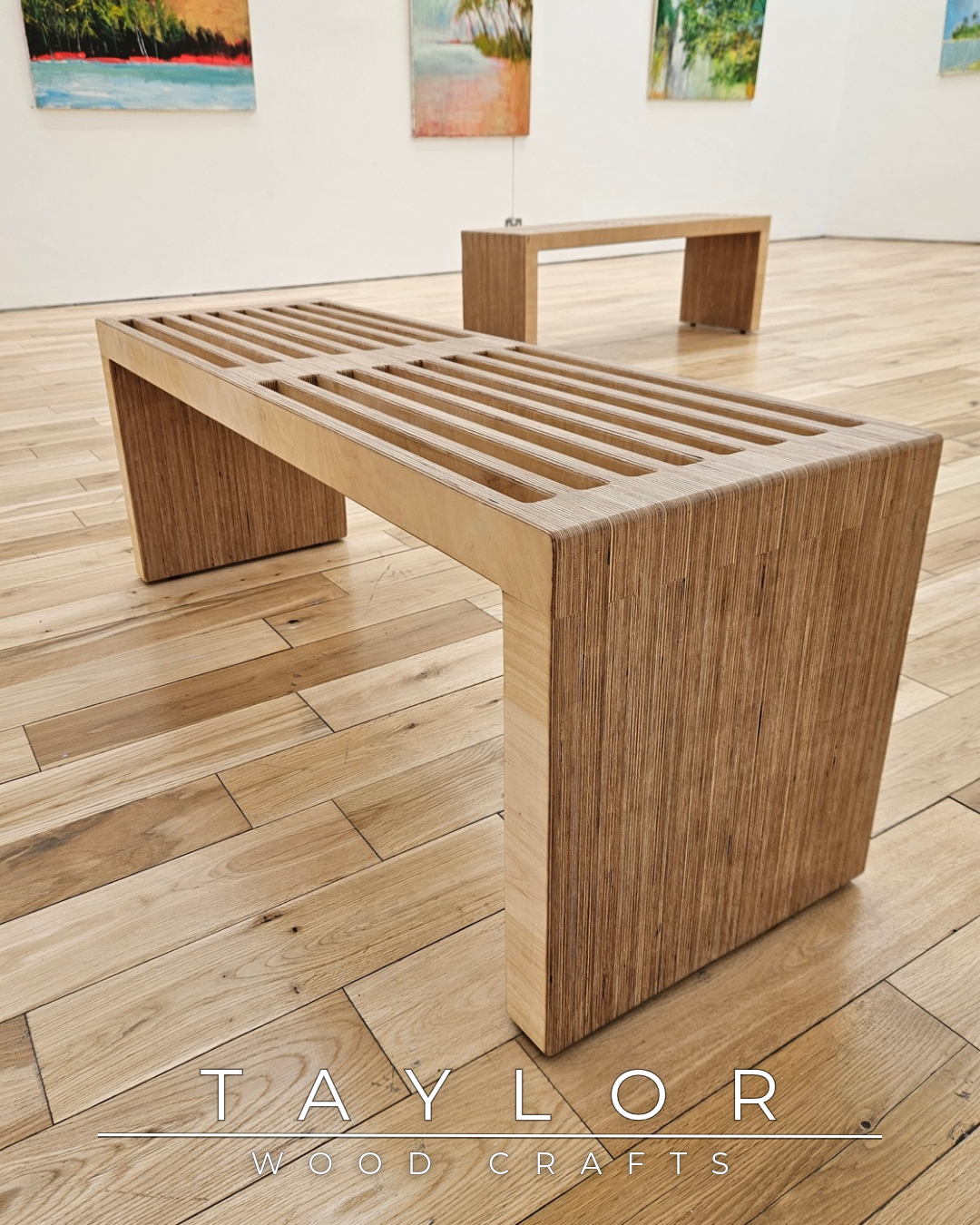 Wooden bench with slatted design on a wooden floor, with 'Taylor Wood Crafts' branding.