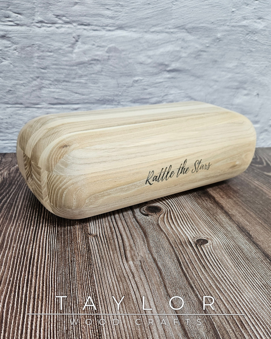 Wooden roller with 'Rattle the Stars' engraving on a wooden surface, branded 'Taylor Wood Crafts'.