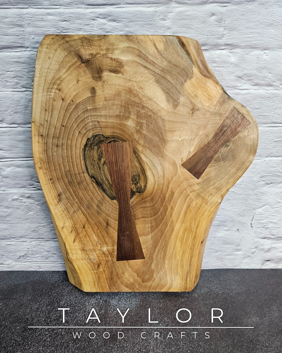 Handcrafted live edge walnut chopping block by Taylor Wood Crafts. Made from premium solid walnut, each board is one of a kind — perfect for cooking, serving, or display.