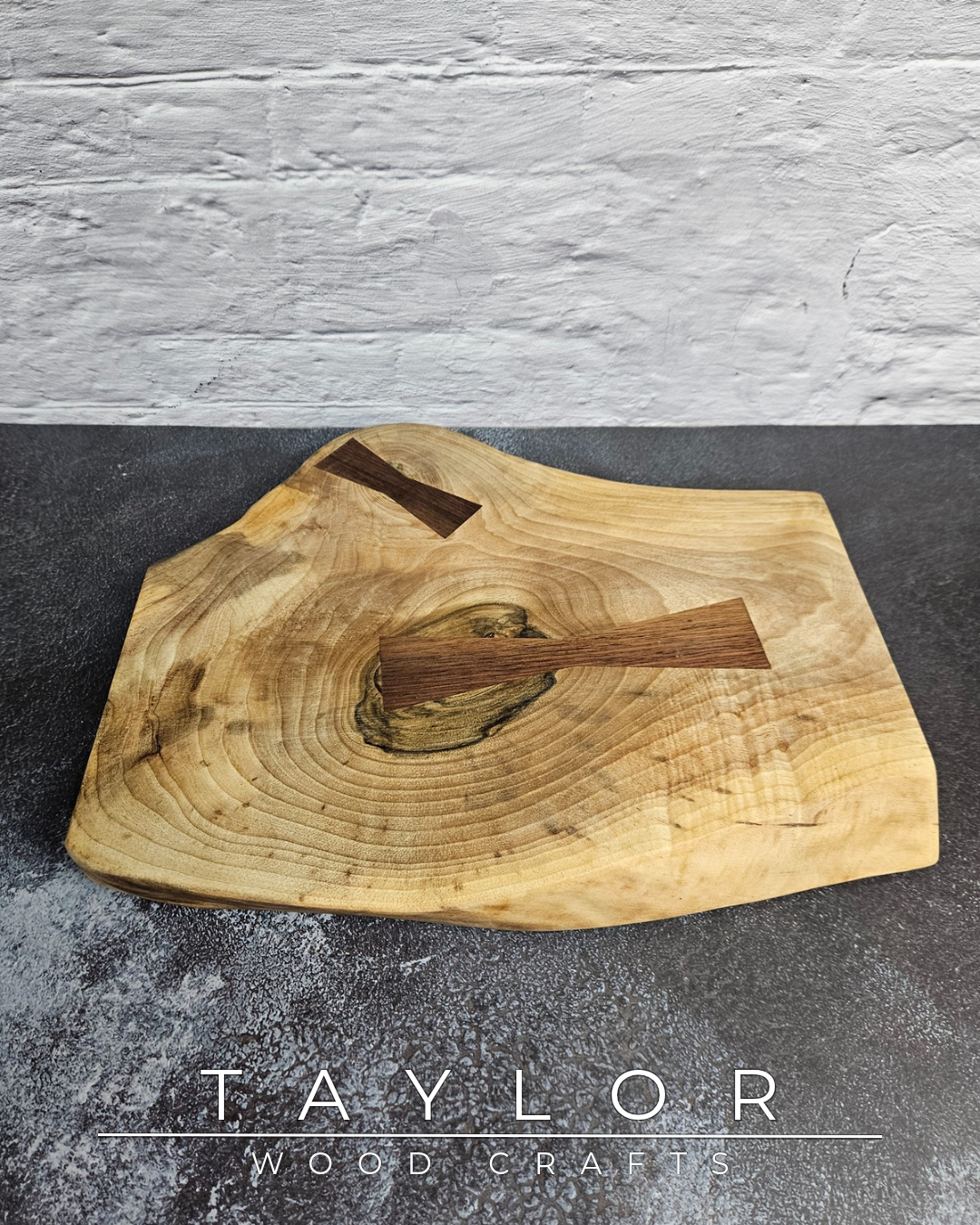 Handcrafted live edge walnut chopping block by Taylor Wood Crafts. Made from premium solid walnut, each board is one of a kind — perfect for cooking, serving, or display.