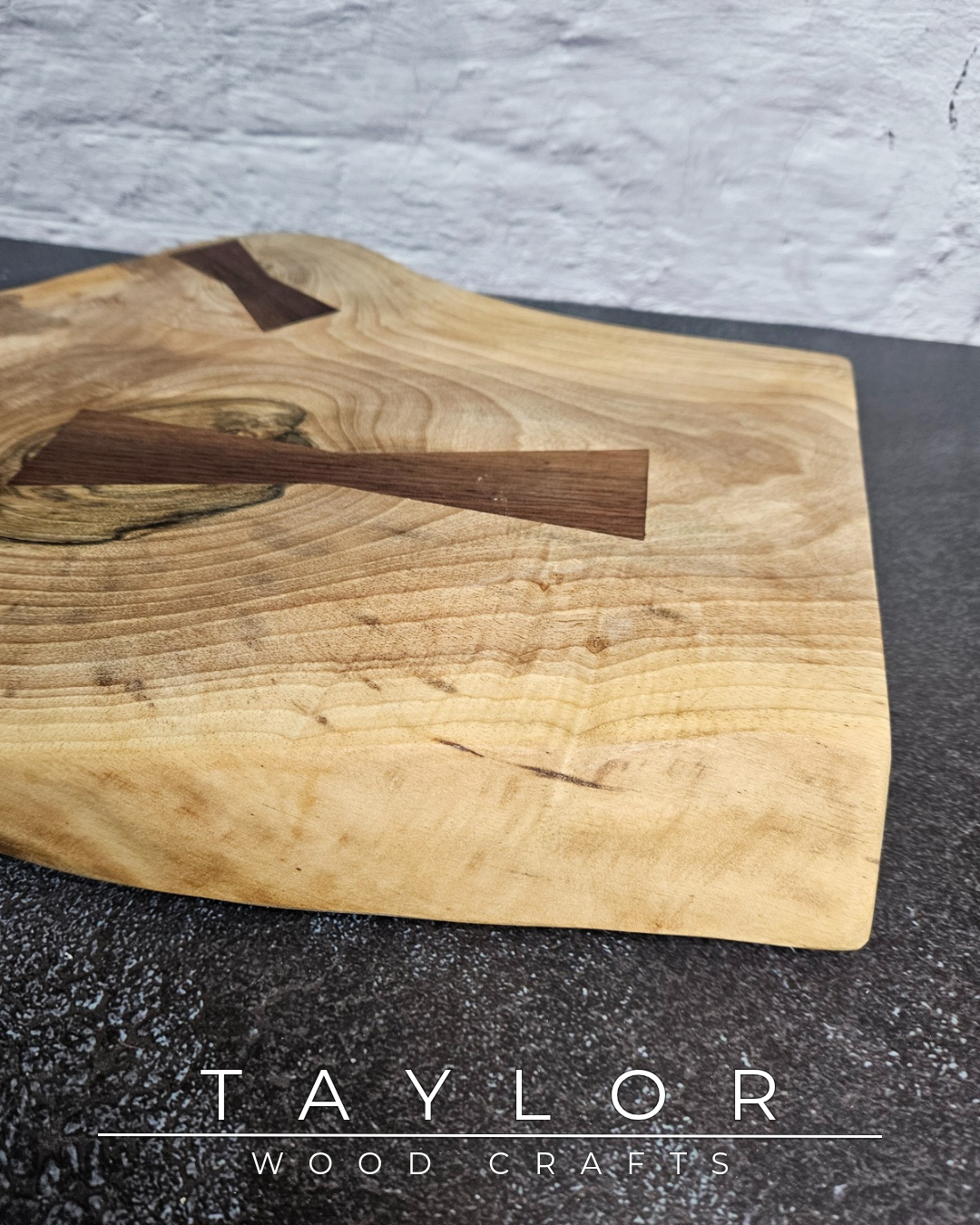 Handcrafted live edge walnut chopping block by Taylor Wood Crafts. Made from premium solid walnut, each board is one of a kind — perfect for cooking, serving, or display.