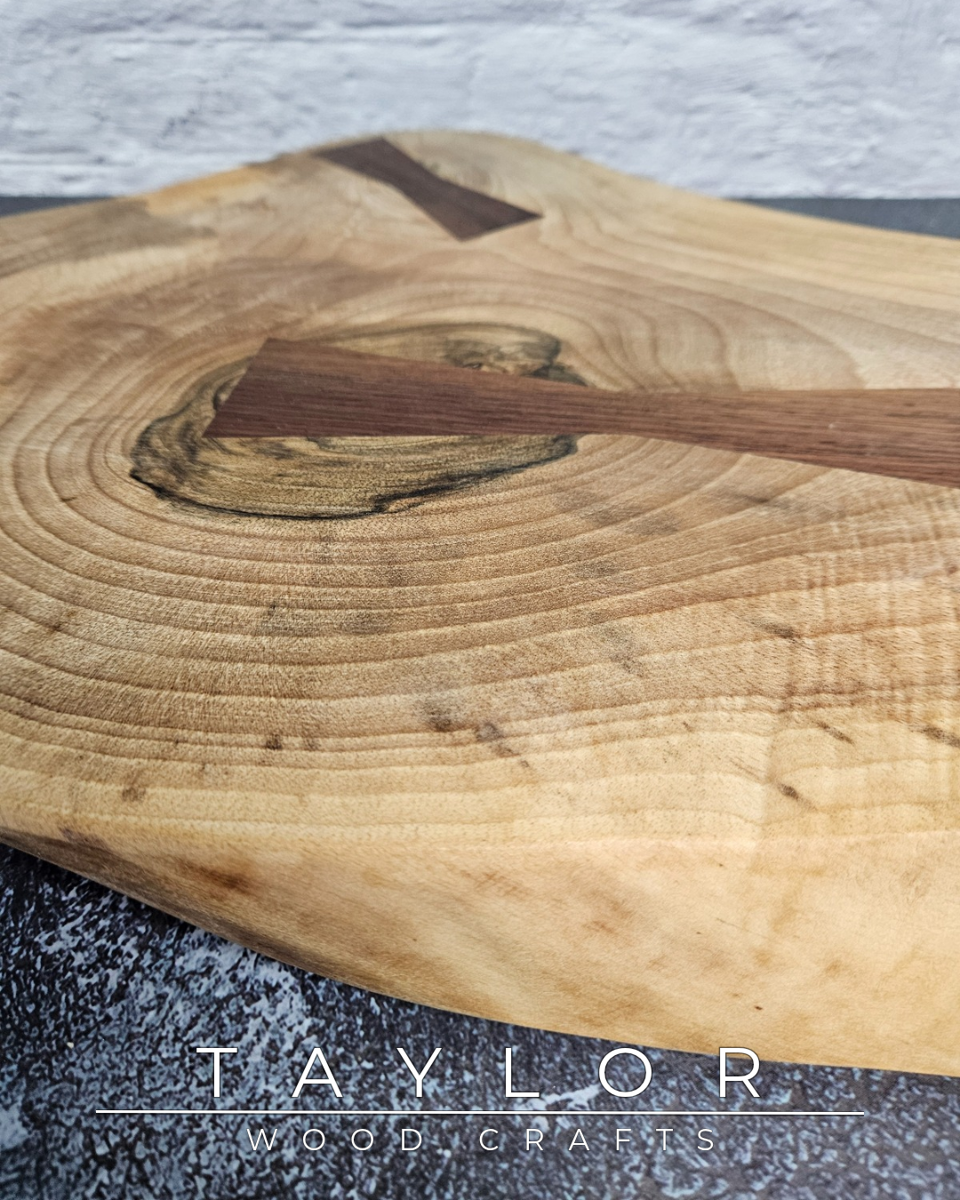 Handcrafted live edge walnut chopping block by Taylor Wood Crafts. Made from premium solid walnut, each board is one of a kind — perfect for cooking, serving, or display.