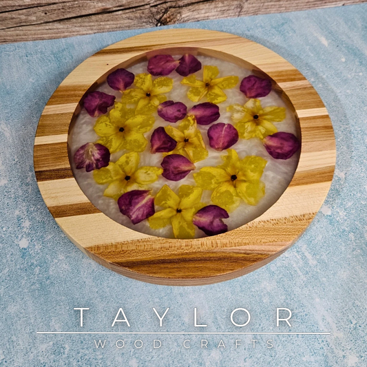 Handcrafted elm centerpiece by Taylor Wood Crafts featuring a resin core with preserved yellow and red flowers for a unique natural display.