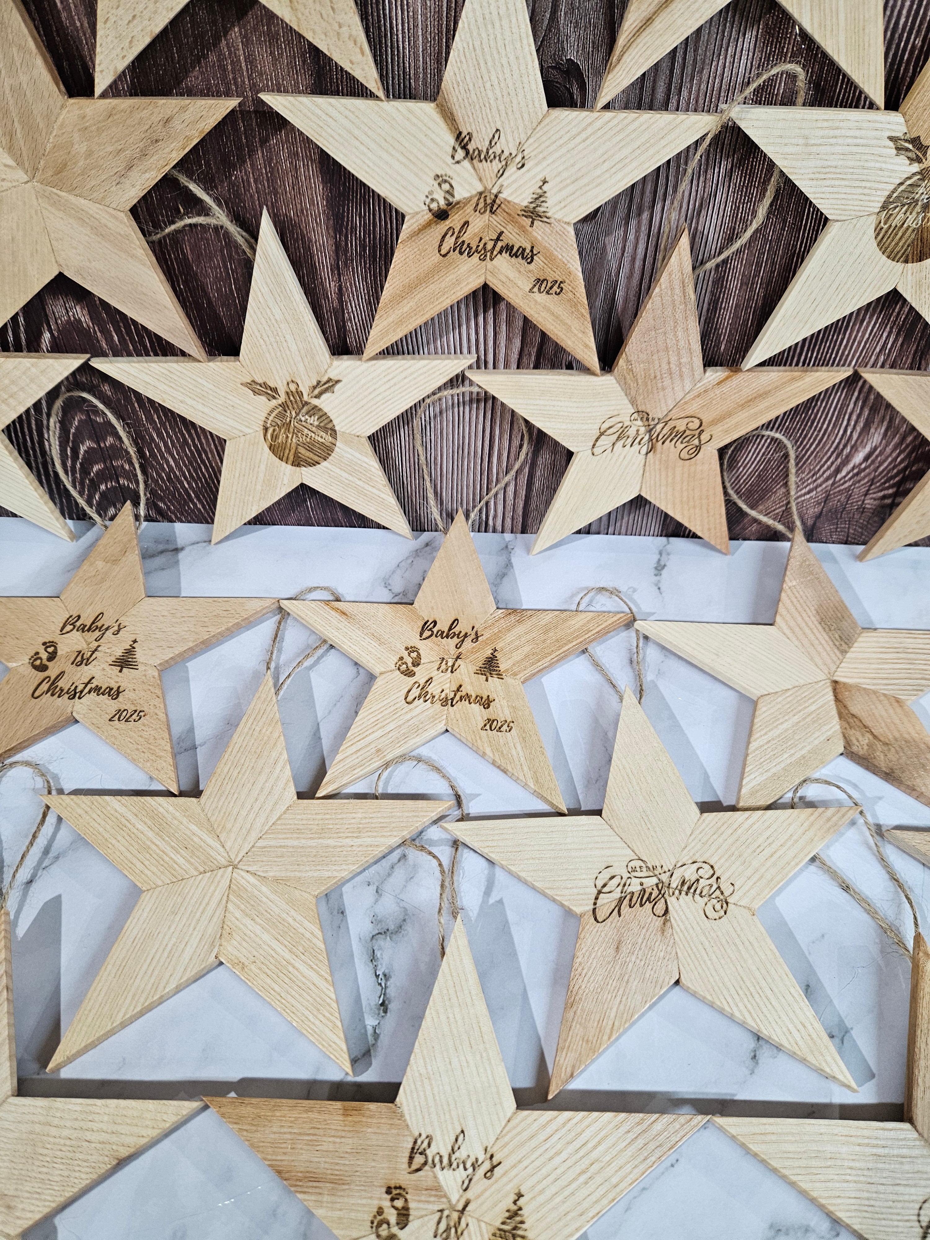 Handcrafted wooden Christmas stars by Taylor Wood Crafts, fully customisable with laser-engraved names or festive graphics.
