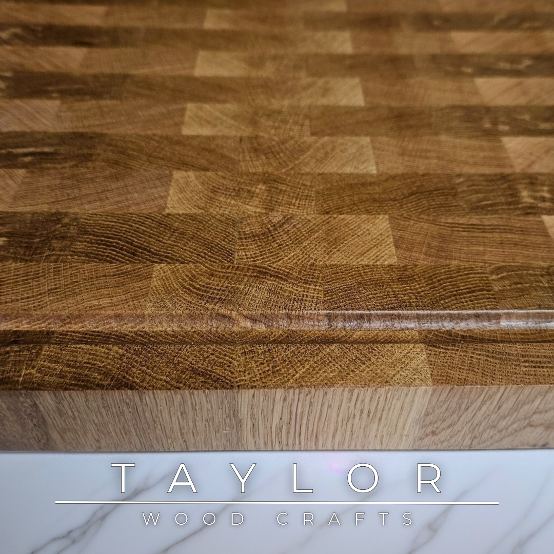 Oak butcher block Taylor Wood Crafts Handmade with rich grain patterns, offering a durable and timeless surface for kitchen prep and serving.