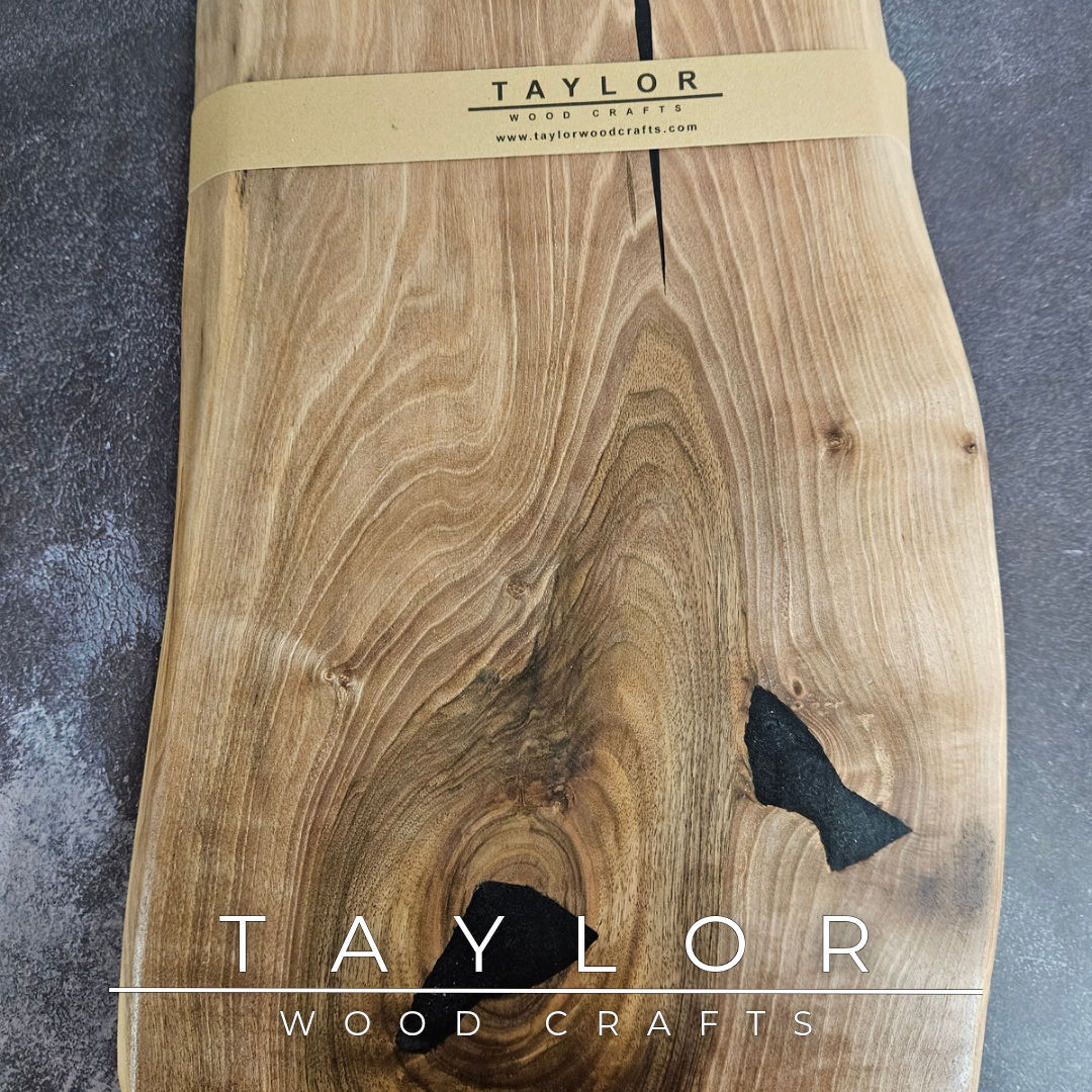 Handmade European Walnut table-top chopping block with distinctive black epoxy resin details, crafted in Northern Ireland.
