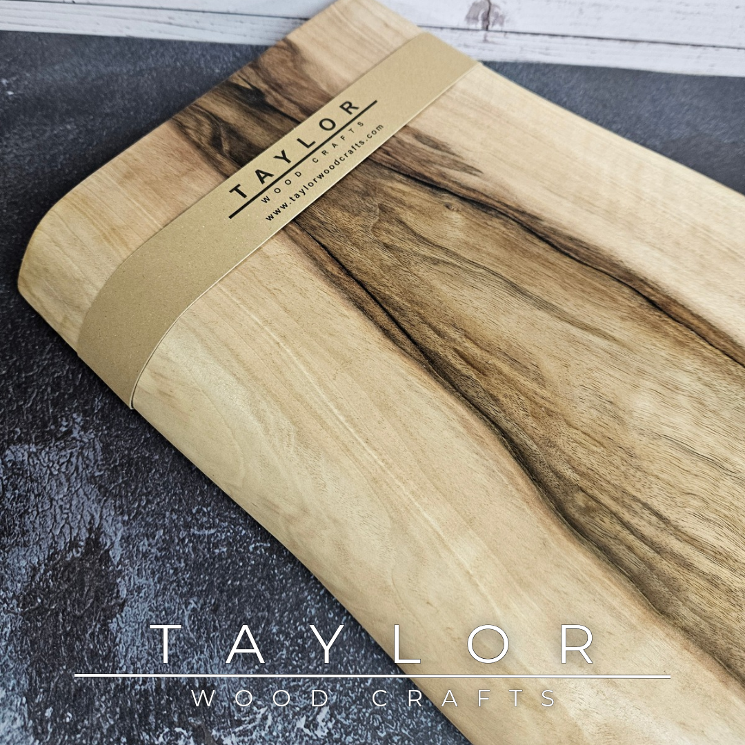 Handmade European Walnut table-top chopping block with distinctive black epoxy resin details, crafted in Northern Ireland.