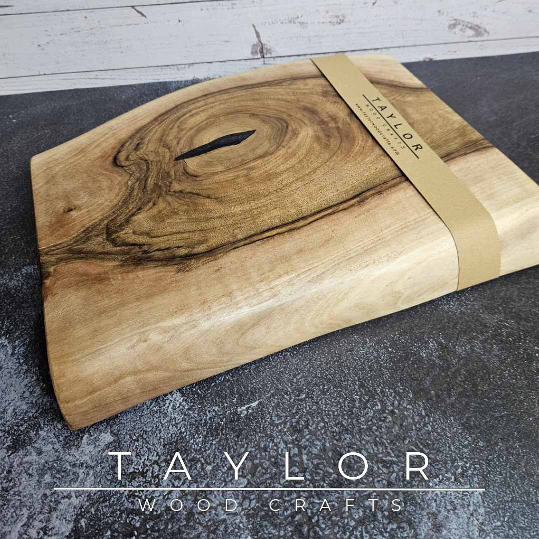 Handmade European Walnut table-top chopping block with distinctive black epoxy resin details, crafted in Northern Ireland.