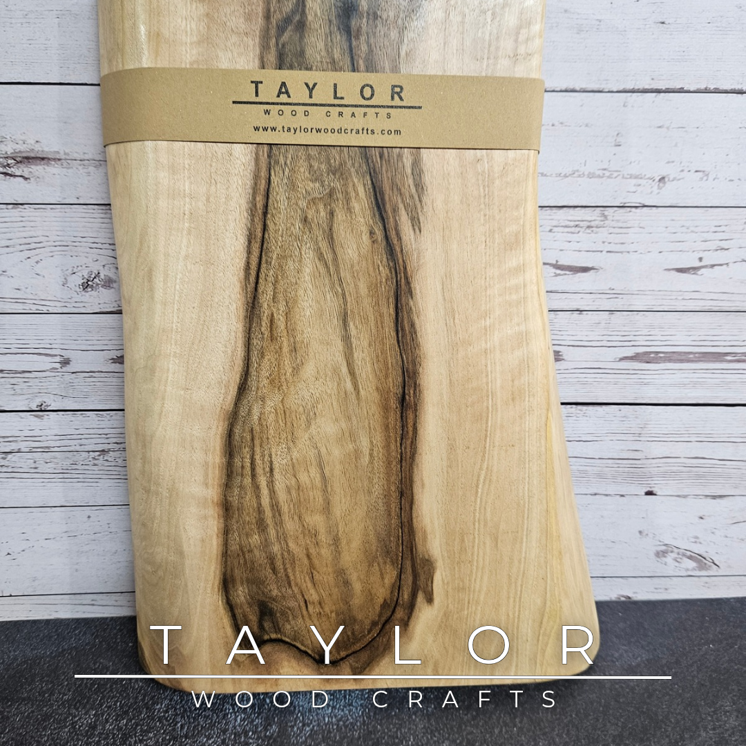 Handmade European Walnut table-top chopping block with distinctive black epoxy resin details, crafted in Northern Ireland.