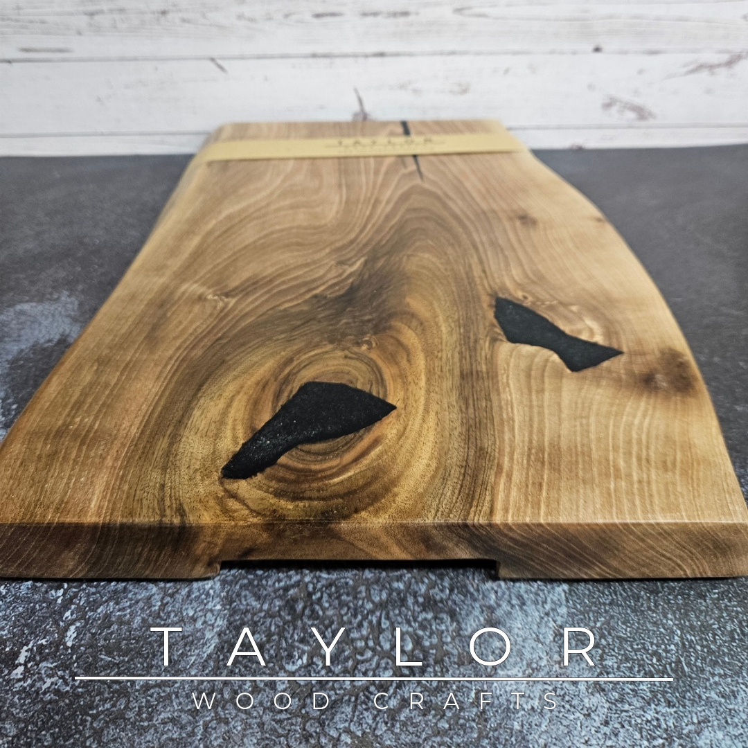 Handmade European Walnut table-top chopping block with distinctive black epoxy resin details, crafted in Northern Ireland.