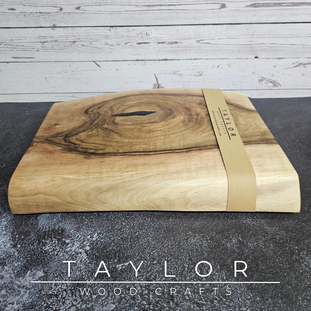 Handmade European Walnut table-top chopping block with distinctive black epoxy resin details, crafted in Northern Ireland.