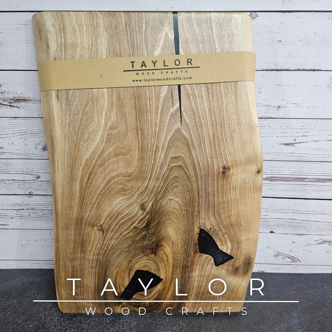 Handmade European Walnut table-top chopping block with distinctive black epoxy resin details, crafted in Northern Ireland.
